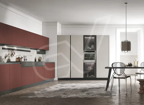 Cocina con frentes en rojo y columna de horno y microondas