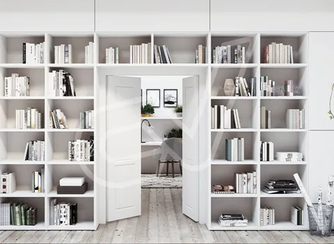Librería blanca que rodea el hueco de paso a otra estancia