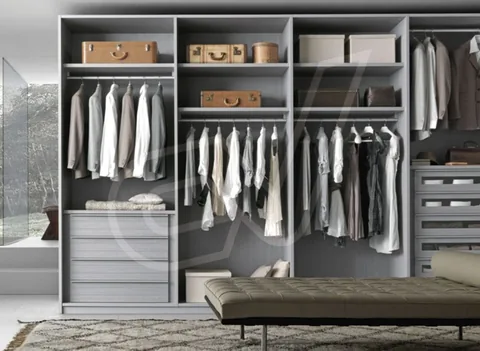 Vestidor en gris con módulos abiertos y banqueta alargada